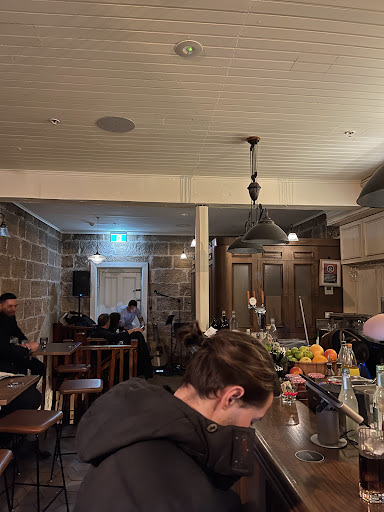 Sandstone and timber interior at Frank Mac's